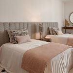 Pink bedroom with neutral tones and wooden console home inspiration ideas