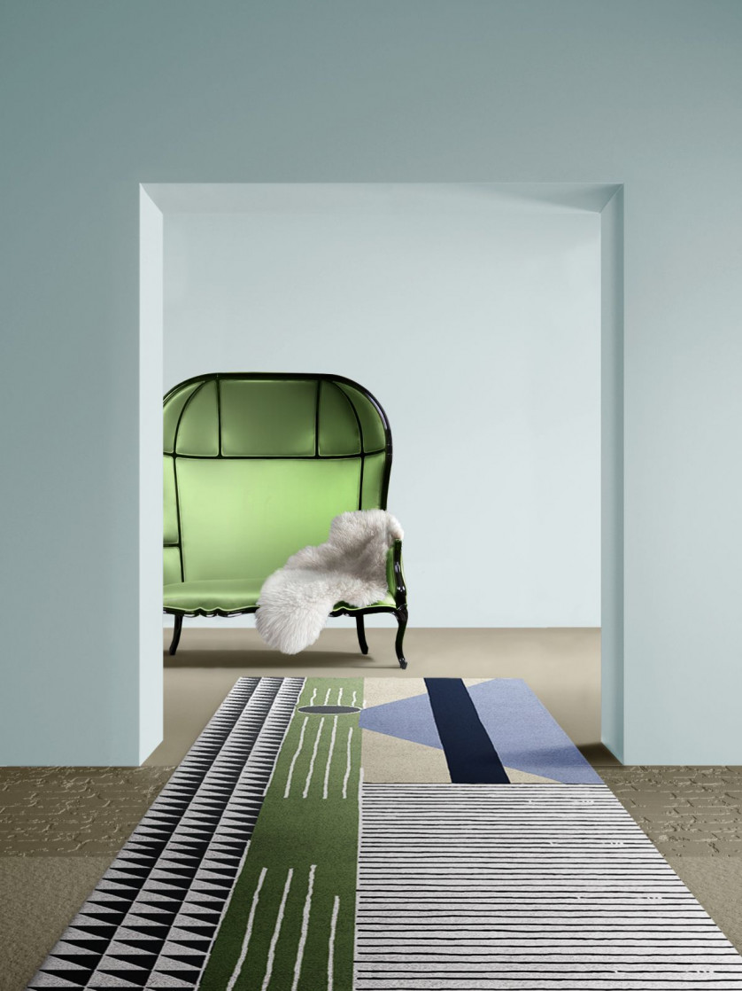 Modern hallway design with blue walls, green chair and the geometric Simba Rug home inspiration ideas